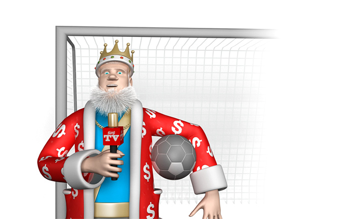 The King is standing in front of goal with a football under one hand and a mic in the other. The report is in progress.