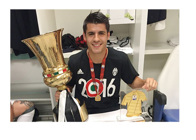 Morata posing for a photo with a trophy wearing a Juventus 2016 winners shirt