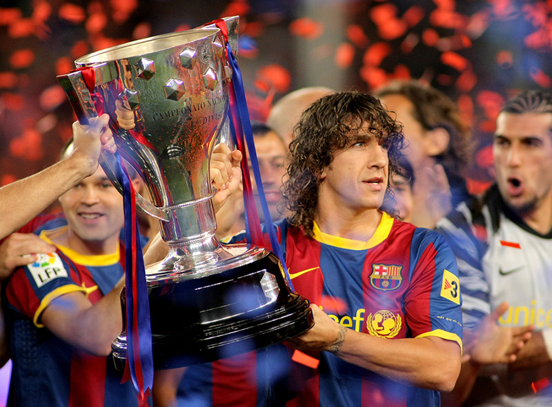 Carles Puyol Lifting the La Liga trophy with Barcelona FC