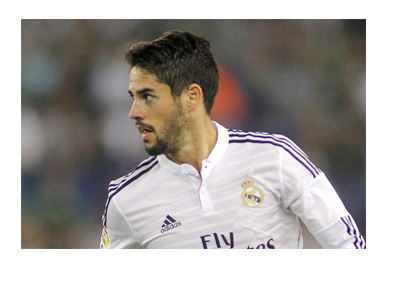 Real Madrid player Isco is looking to pass the ball to one of his teammates