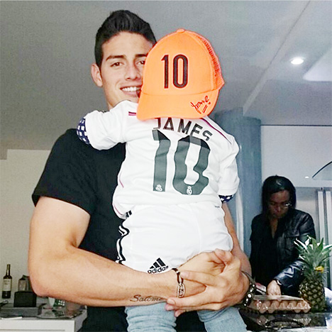 James Rodriguez Instagram photo - With baby wearing the Real Madrid number 10 jersey and cap.