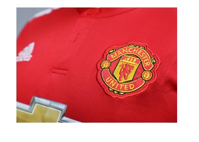 The Manchester United 2017-18 season shirt featuring their sponsor Chevrolet.  Zoomed in.