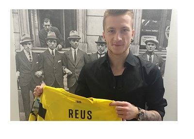 Marco Reus Extends BVB Contract Until 2019 - Holding Jersey in Front of an Old Photo