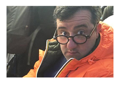 Mino Raiola - Social media profile picture - Red jacket and thick frame glasses