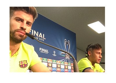 Selfie photo by Barca defender Gerrard Pique at a FIFA press conference.  Neymar is in the background too, answering questions to the press.