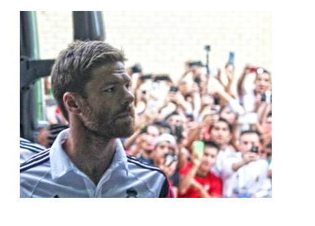 Xabi Alonso on way out of the team bus - Gazing
