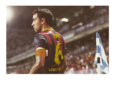 Retro photo of Xavi in a Barcelona home shirt - Number 6 on the back - looking into the distance