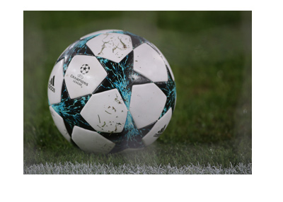 The 2017-18 edition of the UEFA Champions League ball - In action - Covered with grass.