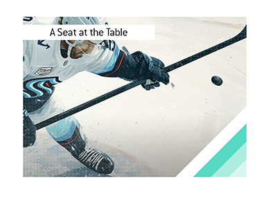 Seattle Kraken player controlling the puck during the team