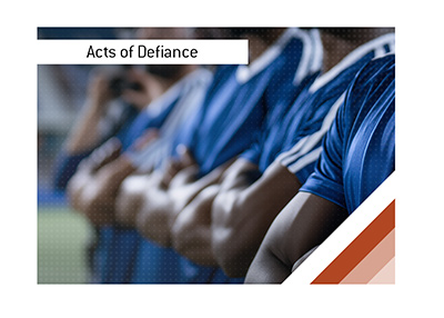 Close-up of a football team standing shoulder-to-shoulder with folded arms before a World Cup match.