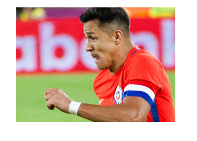 Alexis Sanchez representing Chile.  Red kit.  Year is 2017.