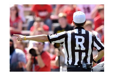 College referee signaling for the corner kick. Odds to win the final at Mercedes-Benz Stadium on January 8th, 2018.