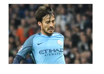 Manchester City FC midfielder - David Silva - In action - Wearing home light blue kit.