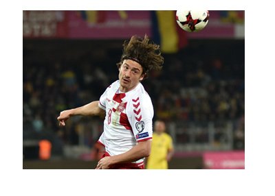 The Denmark midfielder, Thomas Delaney, heading the ball during World Cup qualifiers. Year is 2017.