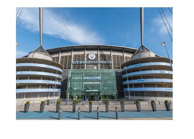 The Etihad Stadium - home of Manchester City Football Club - View from the front.  Sunny day.