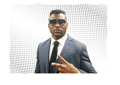 The MMA fighter Francis Ngannou is representing with a peace sign.