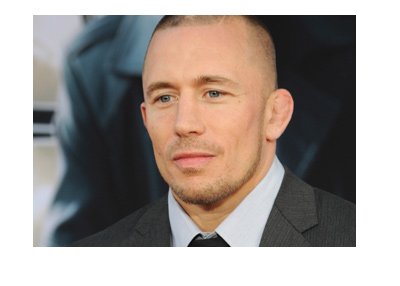 Georges St-Pierre rocking a suit and tie at a movie promotion event.