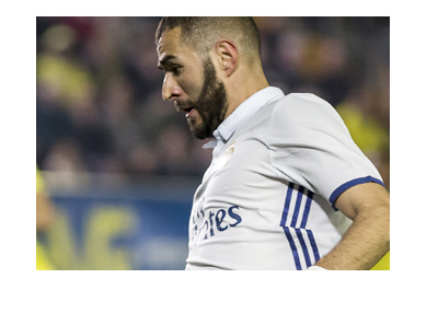 Karim Benzema in action wearing the home Real Madrid 2016/17 jersey.