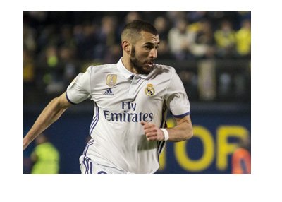 Real Madrid center forward - Karim Benzema - In action, wearing the home white colours.