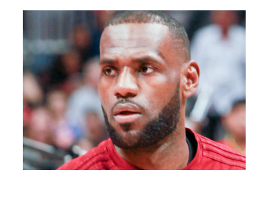 Lebron is sporting a serious look ahead of a basketball match. Focus, check.