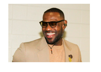 Where is Lebron James going to end up before next season starts?  Pictured wearing a suit and a smile.