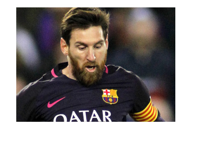 Bearded Lionel Messi in action for Barcelona FC. Dark kit. Year is 2017.