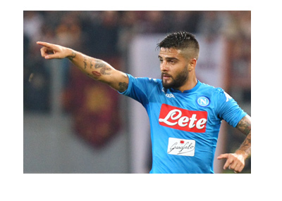 Napoli attacker, Lorenzo Insigne, pointing up, leading his team, hoping for the Scudetto.