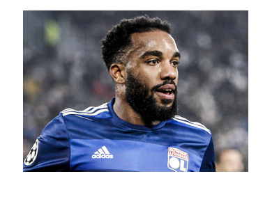 Alexandre Lacazette, the lethal Lyon FC forward, pictured smiling in the photo.  Wearing the home blue.