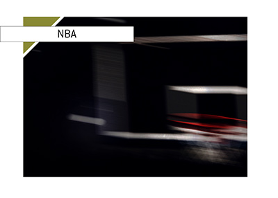 The Basketball board photographed in a dark arena.  NBA 2018/19 season.  Who is the next coach in line to be fired?