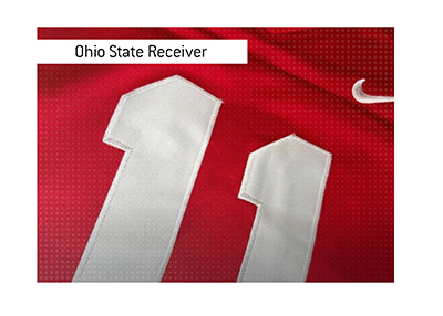 Ohio State receiver Jaxon Smith-Njigba red jersey with white number 11.