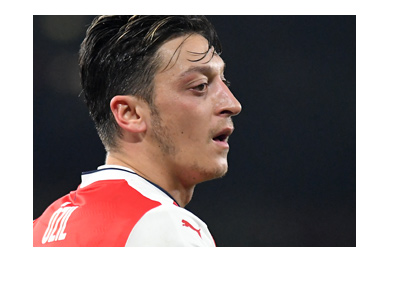 Ozil is breathing heavy. The Game is on. 2016-17 season. Arsenal home kit.
