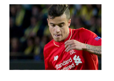 Philippe Coutinho in action for Liverpool Football Club.  Home red kit.