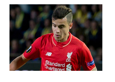 The Liverpool FC midfielder and number 10, Philippe Coutinho. In action wearing his home kit. Classic red.