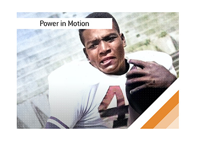 Young Jim Brown runs with a football during a training session, showcasing his early power, speed, and athletic form before his legendary NFL dominance.