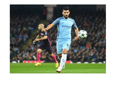 Manchester City striker, Sergio Aguero, in action. About to take a shot.