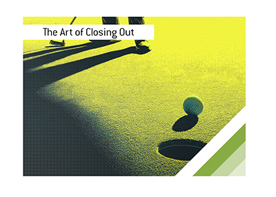 Golf ball sits next to the hole as a golfer watches, capturing the pressure of the moment.