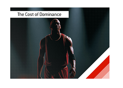 Michael Jordan walking through arena spotlights in a dark championship-era setting.