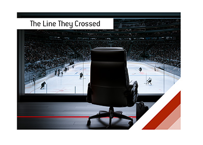 Empty executive chair overlooking a hockey game with a red line crossing the owners suite floor.