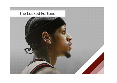 Portrait of Allen Iverson standing beneath arena lights, wearing his signature cornrows.