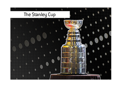 The Stanley Cup trophy in the spotlights.  The teams that have won it three times in a row are...