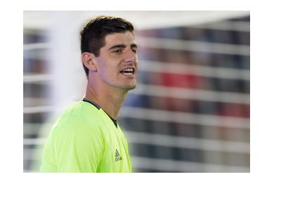 Chelsea FC goalkeeper Thibaut Courtois in training.  Wearing a yellow top.