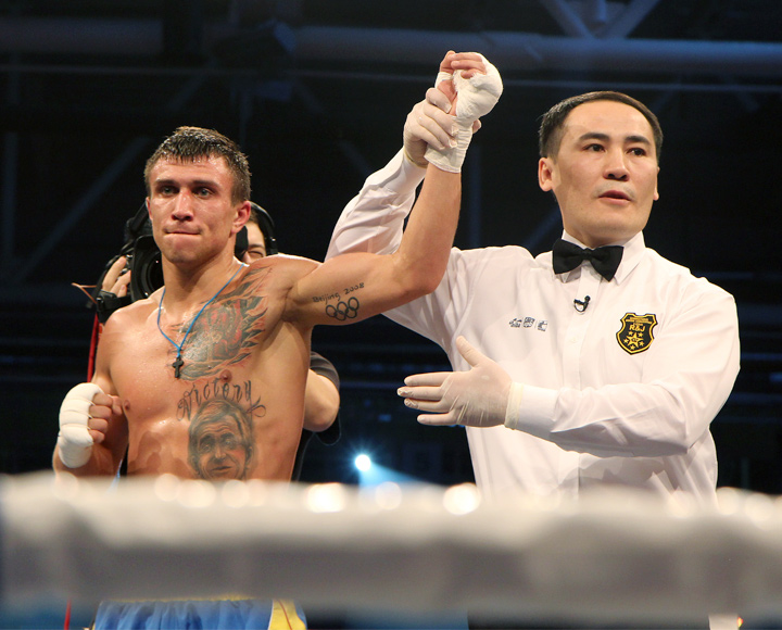 Archive photo of the victorious Vasyl Lomachenko. Hand is held up by the referee after the match.