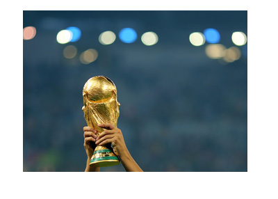 The World Cup trophy lifted high up in the air during celebrations.