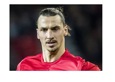 Zlatan Ibrahimovic sporting the Manchester United bright red home kit. Year is 2017. Signature pose.