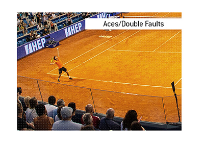 Tennis betting term explained - Match Total Aces / Double Faults.  In photo:  Clay surface player serves.