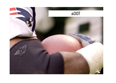 The Sports King explains the meaning of the football term adot or Average Depth of Target and outlines the significance of the statistic.  In photo:  New England Patriots player running with the ball.