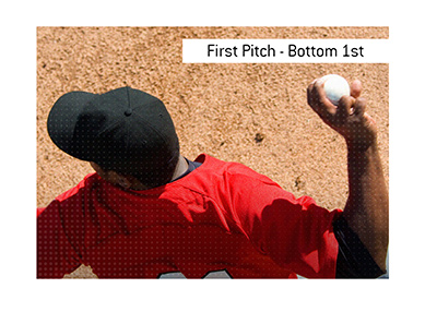 The meaning of the baseball betting term First Pitch Result Bottom 1st is explained.  In photo:  player throwing the ball.  Birds eye view.