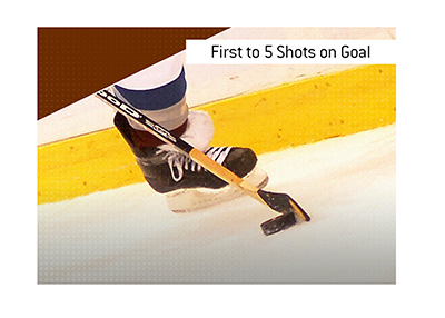 The meaning of the betting term First to 5 Shots on Goal is explained when it comes to the game of hockey.  In photo:  Colorado Avalanche player with the puck.