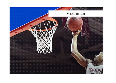 The King explains the meaning of the term Freshman when it comes to college sports in the United States of America.  In photo:  A basketball player going for the layup.