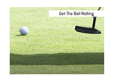 The definition of the term Get the Ball Rolling is explained when it comes to sports and also real life.  In photo:  golf ball and a putter.